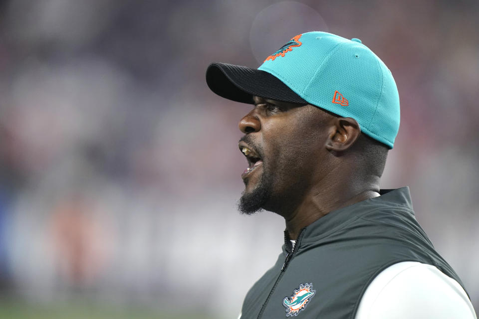 Miami Dolphins head coach Brian Flores calls to his players during the second half of an NFL football game against the New England Patriots, Sunday, Sept. 12, 2021, in Foxborough, Mass. (AP Photo/Steven Senne)