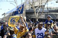 Fans cheer during the Los Angeles Rams' victory parade and celebration in Los Angeles, Wednesday, Feb. 16, 2022, following the Rams' win Sunday over the Cincinnati Bengals in the NFL Super Bowl 56 football game. (AP Photo/Kyusung Gong)