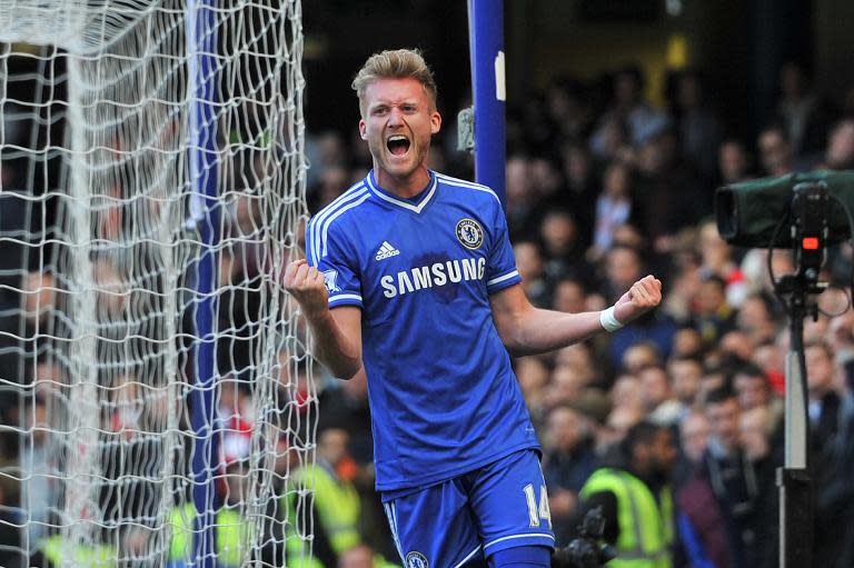 Chelsea's Andre Schurrle celebrates after scoring during their Premier League match against Arsenal at Stamford Bridge on March 22, 2014