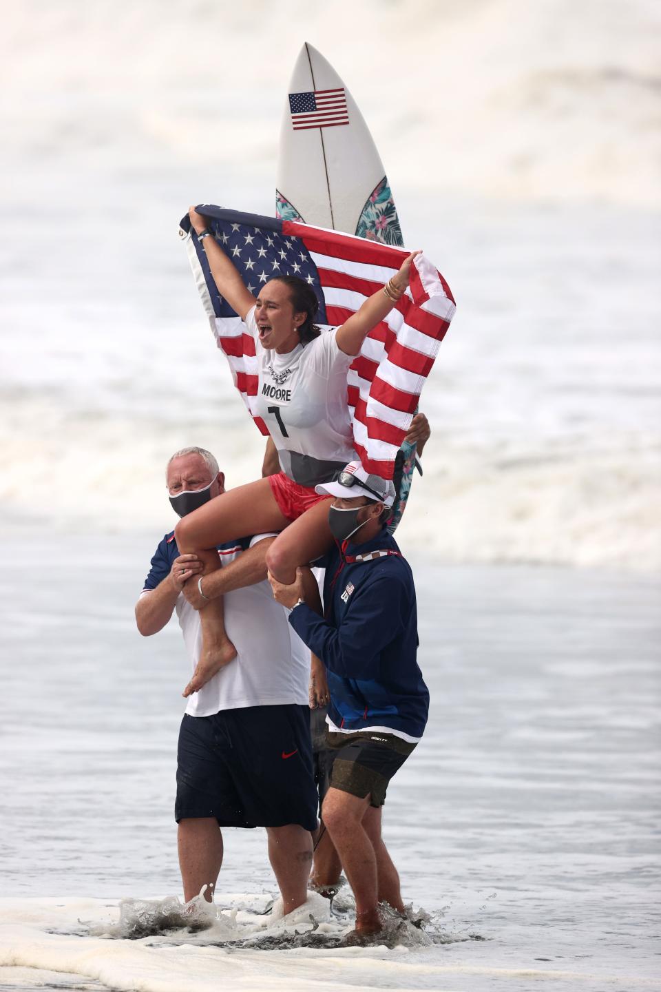 Carissa Moore celebrates winning the gold medal after her final match against Bianca Buitendag.