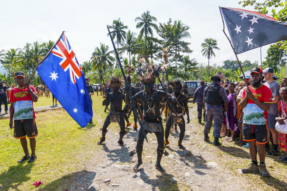 In this image supplied by the Australian Prime Ministers office, villagers perform a traditional welcome ceremony for Australian Prime Minister Anthony Albanese prior to his walk with Papua New Guinea Prime Minister James Marape along the Kokoda Track at Kokoda Village, Papua New Guinea, Tuesday, April 23, 2024. The prime ministers on Tuesday began trekking into the South Pacific island nation’s mountainous interior to commemorate a pivotal World War II campaign and to underscore their current security alliance that is challenged by China's growing regional influence. (Prime Ministers office via AP)