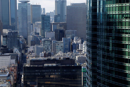 Office buildings are pictured at a business district in Tokyo, Japan, February 12, 2017. Picture taken February 12, 2017. REUTERS/Toru Hanai