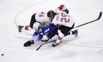 <p>Gigi Marvin (19), of the United States, collides between Renata Fast (14), of Canada, and Marie-Philip Poulin (29), of Canada, during the first period of the women’s gold medal hockey game at the 2018 Winter Olympics in Gangneung, South Korea, Thursday, Feb. 22, 2018. (AP Photo/Matt Slocum) </p>
