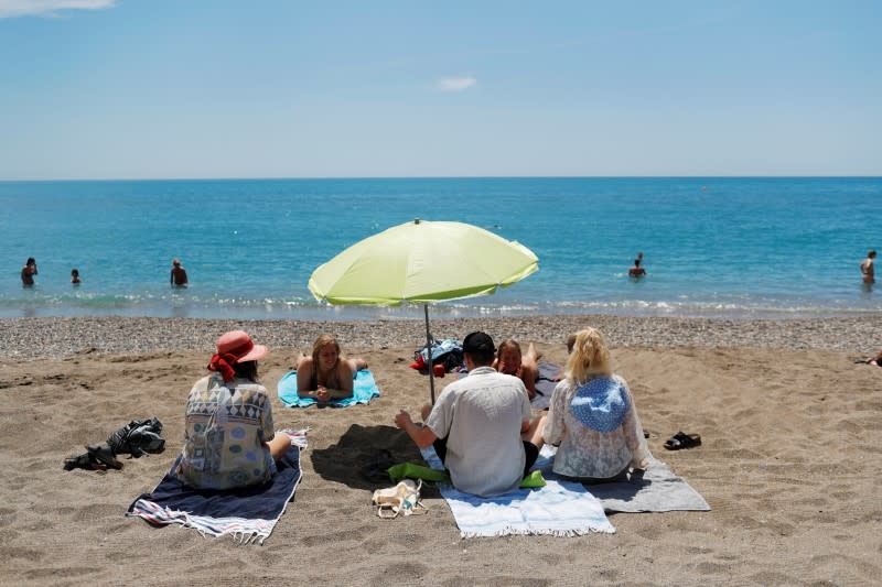 People enjoy on La Malagueta beach as some Spanish provinces are allowed to ease lockdown restrictions during phase two, amid the coronavirus disease (COVID-19) outbreak, in Malaga