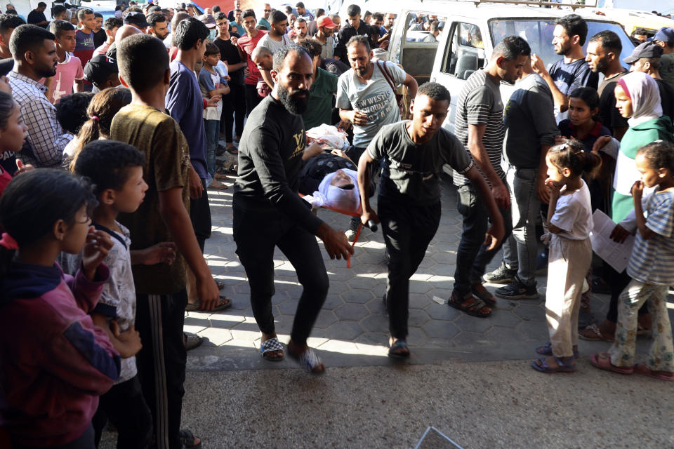 A Palestinian woman wounded in an Israeli bombardment on the Gaza Strip is brought to Al Aqsa hospital in Deir al Balah, central Gaza Strip, on Sunday, June 2, 2024. (AP Photo/Saher Alghorra)