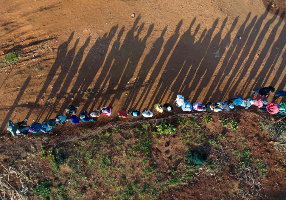 A drone view shows people queue at the Hospital Hill township to vote during the South African elections, in Johannesburg, South Africa May 29, 2024.