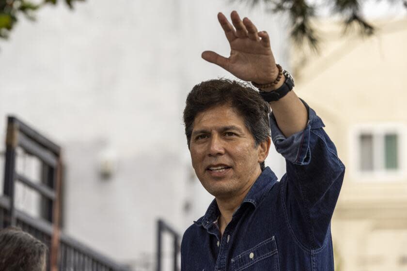 Los Angeles, CA - September 21: Embattled 14th District Los Angeles City Council member Kevin de Leon waves to a person as hundreds of needy people attend his food distribution outside his council office in Los Angeles Thursday, Sept. 21, 2023. Kevin de Leon, who announced his reelection bid, was caught in racist recording last fall which was followed by a large outpouring of community members, colleagues, local leaders, Gov. Newsom and President Biden asking him to resign. (Allen J. Schaben / Los Angeles Times)