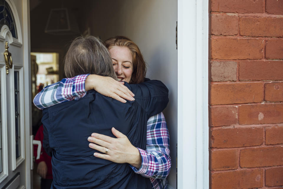 A single mother hugs her mother and shares a tender bonding moment with each other.