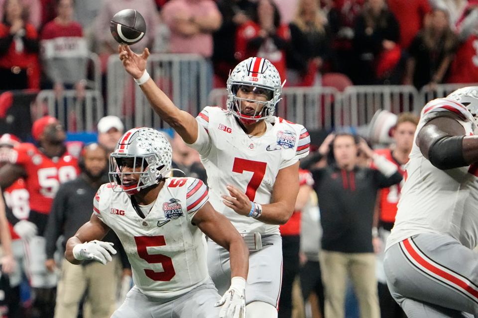 Dec 31, 2022; Atlanta, Georgia, USA;  Ohio State Buckeyes quarterback C.J. Stroud (7) throws a pass during the second half of the Peach Bowl in the College Football Playoff semifinal at Mercedes-Benz Stadium. Ohio State lost 42-41. Mandatory Credit: Adam Cairns-The Columbus Dispatch