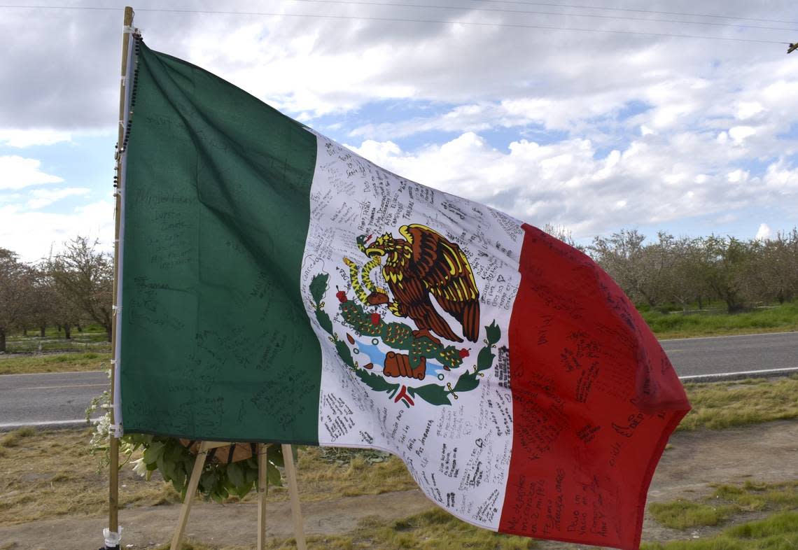 A Mexican flag waving at the memorial for farm workers in Madera contains messages written in Spanish that read phrases such as “rest in peace” and “may God hold them in His holy glory.” All of the seven farm workers killed in the crash in Madera on Feb. 23 were from Mexico.