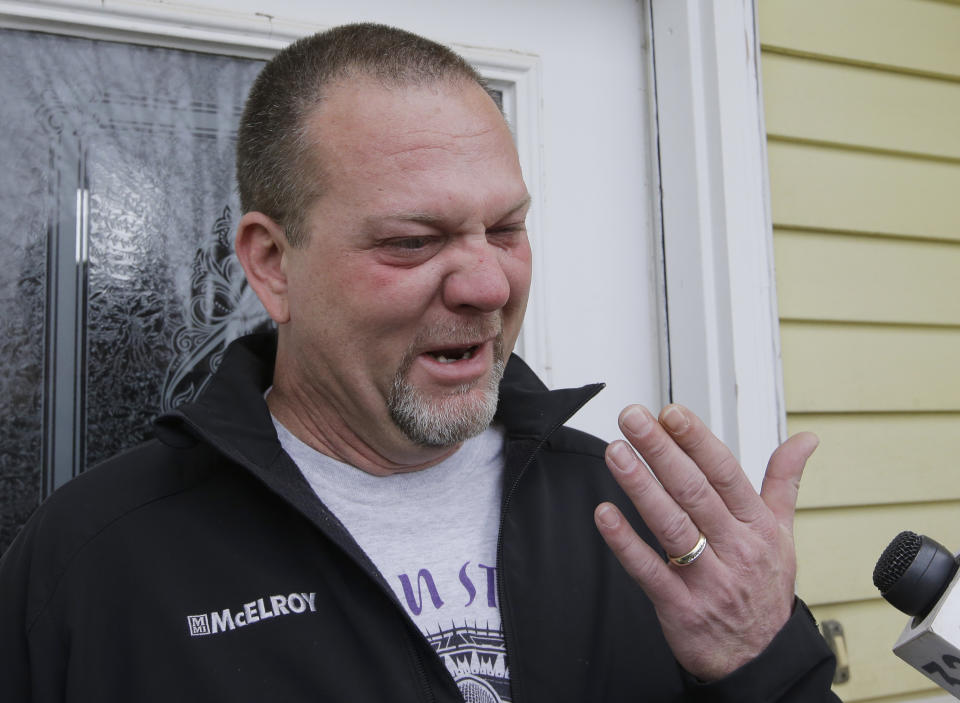 Bret Layton cries as he talks with reporters about his friend and business associate, Kurt W. Cochran, Thursday, March 23, 2017, in West Bountiful, Utah. Kurt W. Cochran was killed and his wife, Melissa Cochran, was among dozens who were injured in Wednesday's London attack according to a statement issued Thursday by the family through a Mormon church spokesman. (AP Photo/Rick Bowmer)