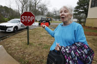 Dorothy Freeman, 82, a 21-year resident of the Harbor Pines community in Ridgeland, Miss., says she is "praying for my neighbors who live in the back part of our neighborhood who are flooded," Tuesday, Feb. 18, 2020, after being allowed to go home to retrieve some clothing and her Bible. Her residence is on higher ground and was not flooded. Some residents are allowed to enter their homes in the non-flooded portion of the mobile home community to retrieve clothing and prescriptions. (AP Photo/Rogelio V. Solis)