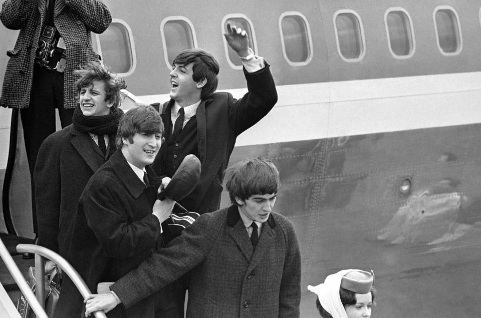The Beatles as they land in New York for the first time in 1964: From left, Ringo Starr, John Lennon, Paul McCartney and George Harrison.