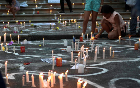 People light candles during a protest against Brazilian mining company Vale SA, in Belo Horizonte, Brazil January 31, 2019. REUTERS/Washington Alves