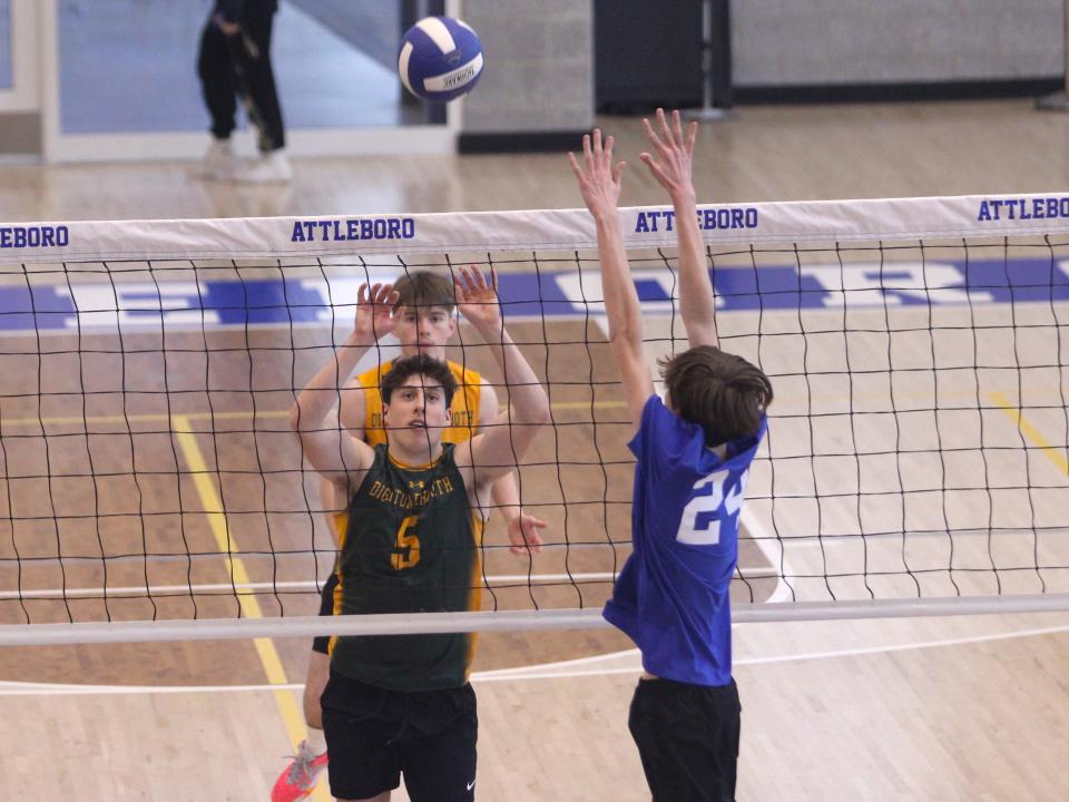 Dighton-Rehoboth's Dylan Andreozzi sends a volley past Attleboro's Nathan Ydrach during a non-league match.