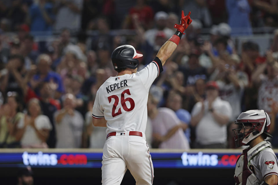 Minnesota Twins' Max Kepler (26) celebrates his home run against the Arizona Diamondbacks during the sixth inning of a baseball game Friday, Aug. 4, 2023, in Minneapolis. (AP Photo/Stacy Bengs)