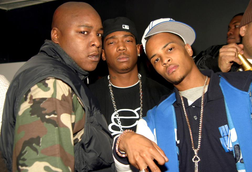 From left: Jadakiss, Ja Rule and T.I. in New York City in Nov. 2004. (Johnny Nunez / WireImage via Getty Images file)