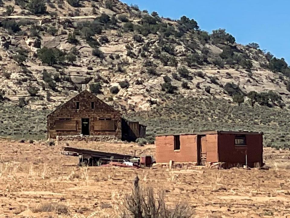 Although a bit hard to see, it appears a wooden cross dangles from the doorframe of one building that was originally part of Home of Truth.