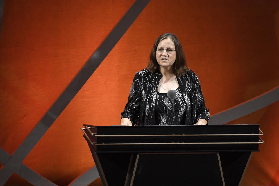 Marianne Stanley addresses a gathering during her enshrinement ceremony for the Basketball Hall of Fame, Saturday, Sept. 10, 2022, in Springfield, Mass. (AP Photo/Jessica Hill)