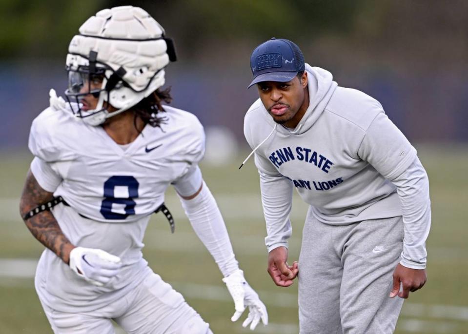 Penn State wide receivers coach Marques Hagans yells to Tyler Johnson as he runs a play during a spring practice on Tuesday, March 26, 2024.