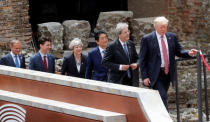 From R-L, U.S. President Donald Trump, Italian Prime Minister Paolo Gentiloni, Japanese Prime Minister Shinzo Abe, Britain’s Prime Minister Theresa May, Canadian Prime Minister Justin Trudeau and European Council President Donald Tusk arrive for a family photo during the G7 Summit in Taormina, Sicily, Italy, May 26, 2017. REUTERS/Philippe Wojazer