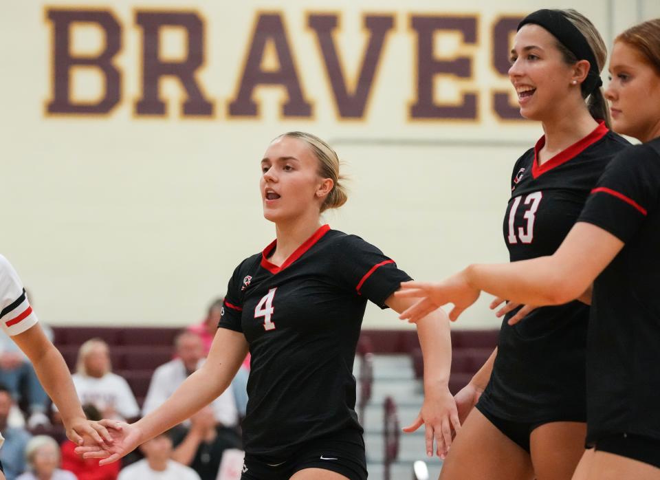 Center Grove Trojans Sophie Sabol (4) gathers with teammates Thursday, Sept. 14, 2023, during the game at Brebeuf Jesuit Preparatory School in Indianapolis. The Center Grove Trojans defeated Brebeuf Jesuit, 3-2.