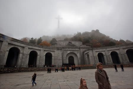 FILE PHOTO: People leave after attending mass at the basilica where the tombs of Spain's former dictator General Francisco Franco and Jose Antonio Primo de Rivera, founder of the right-wing group Falange, lie in the Valle de los Caidos (Valley of the Fallen) near Madrid November 20, 2011. REUTERS/Susana Vera/File Photo