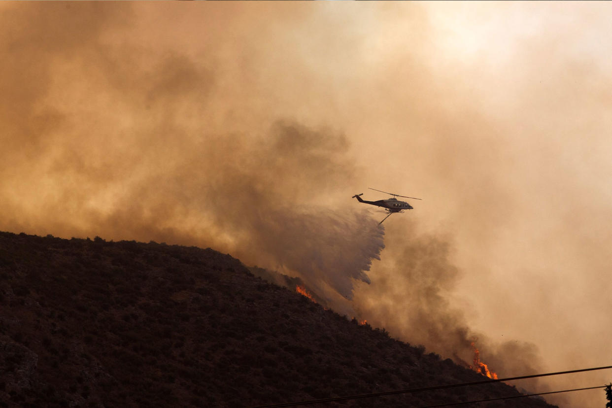 Greece wildfire helicopter Marios Lolos/Xinhua via Getty Images