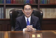 Japan’s former Foreign Minister Fumio Kishida poses for a portrait picture following his press conference at the headquarters of the Liberal Democratic Party after he was elected as party president in Tokyo Wednesday, Sept. 29, 2021. Kishida won the governing party leadership election on Wednesday and is set to become the next prime minister, facing the imminent task of addressing a pandemic-hit economy and ensuring a strong alliance with Washington to counter growing regional security risks. (Du Xiaoyi/Pool Photo via AP)