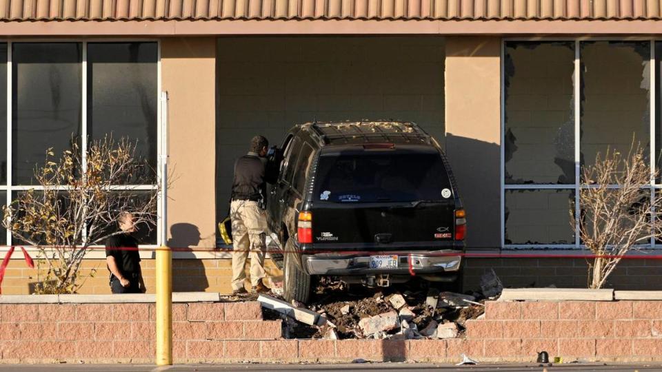 A driver crashed into the front wall of the Walmart Supercenter in the Plaza at the Speedway shopping center in Kansas City, Kansas, Thursday, Dec. 2, 2021. Two people were injured and one was killed.