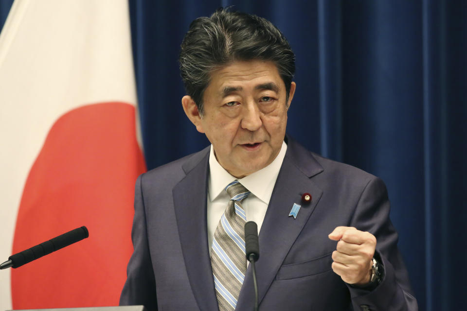 Japanese Prime Minister Shinzo Abe speaks during a press conference in Tokyo, Monday, Dec. 9, 2019. Abe said his country is arranging Iranian President Hassan Rouhani's visit to Japan as the country seeks to play a greater role in relieving tension in the Middle East where Japanese oil imports mainly come from. (AP Photo/Koji Sasahara)