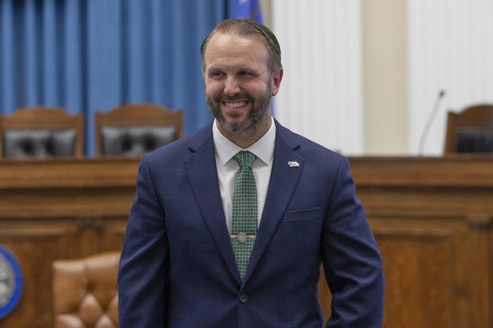 Nevada Deputy Secretary of State for elections Mark Wlaschin smiles before Governor Joe Lombardo signed an election worker protection bill into law as Secretary of State Cisco Aguilar looks on at the old Assembly Chambers in Carson City, Nev., Tuesday, May 30, 2023. (AP Photo/Tom R. Smedes)