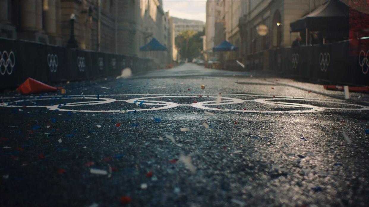 Olympic rings on pavement.