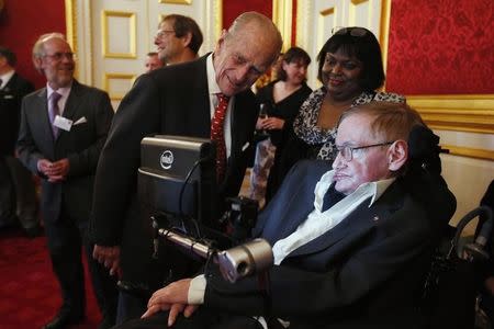 Britain's Prince Philip meets Stephen Hawking (R) during a reception for Leonard Cheshire Disability charity at St James's Palace in London May 29, 2014. REUTERS/Jonathan Brady/Pool