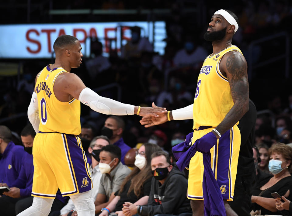 LOS ANGELES, CA - OCTOBER 12: LeBron James #6 and Russell Westbrook #0 of the Los Angeles Lakers on the basketball court together during the second half of a preseason basketball game against the Golden State Warriors at Staples Center on October 12, 2021 in Los Angeles, California. NOTE TO USER: User expressly acknowledges and agrees that, by downloading and/or using this Photograph, user is consenting to the terms and conditions of the Getty Images License Agreement. (Photo by Kevork Djansezian/Getty Images)