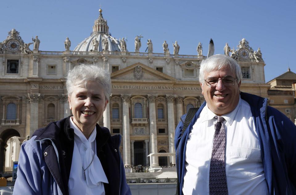 Sister Jeannine Gramick and Francis DeBernardo of New Ways Ministry, which ministers to homosexual Catholics and promotes gay rights, pose in front of St. Peter's Square after Pope Francis' weekly audience, February 18, 2015. The prominent American Catholic gay rights group was given VIP treatment for the first time at an audience with Pope Francis on Wednesday, a move members saw as a sign of change in the Roman Catholic Church. REUTERS/Giampiero Sposito (VATICAN - Tags: RELIGION)