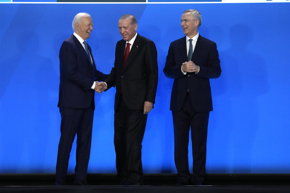 President Joe Biden, left, and NATO Secretary General Jens Stoltenberg, right, greet Recep Tayyip Erdogan, President of Turkey, as they arrive for a welcome ceremony at the NATO summit in Washington, Wednesday, July 10, 2024. (AP Photo/Mark Schiefelbein)