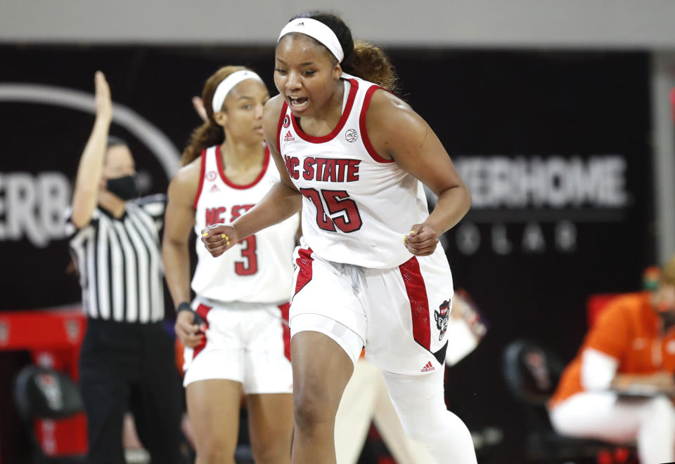 North Carolina State's Kayla Jones (25) celebrates making a 3-pointer against Clemson during the first half of an NCAA college basketball game at Reynolds Coliseum in Raleigh, N.C., Thursday, Feb. 11, 2021. (Ethan Hyman/The News & Observer via AP)