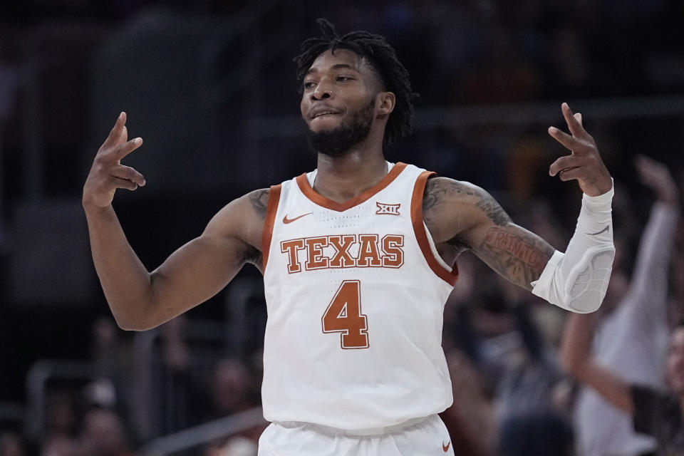 Texas guard Tyrese Hunter (4) celebrates a score against UNC Greensboro during the first half of an NCAA college basketball game in Austin, Texas, Friday, Dec. 29, 2023. (AP Photo/Eric Gay)