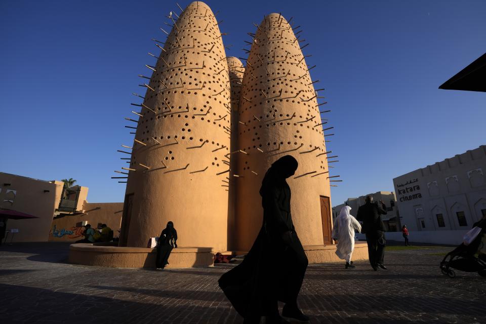 People walk at the Katara Cultural Village in Doha, Qatar, Monday, Nov. 28, 2022. (AP Photo/Jorge Saenz)