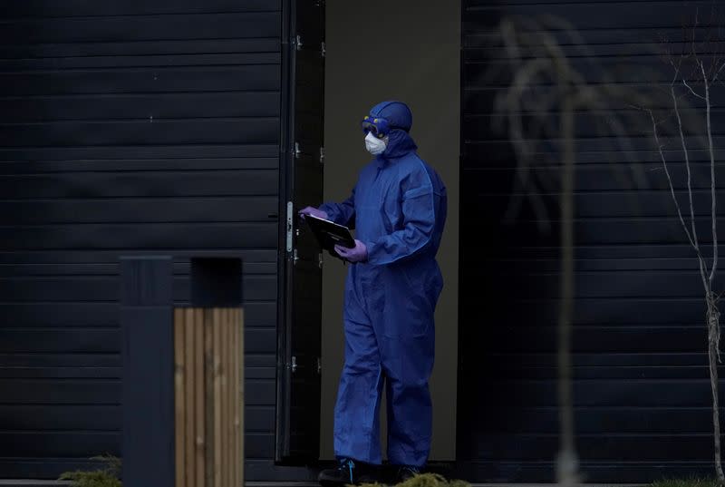 A medical specialist walks out of a hospital for patients infected with the coronavirus disease on the outskirts of Moscow