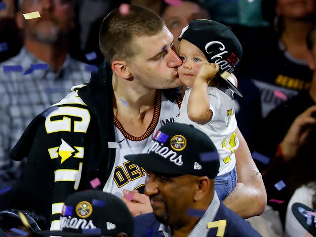 <p>Justin Edmonds/Getty</p> Nikola Jokic with his daughter Ognjen after the 2023 NBA Finals