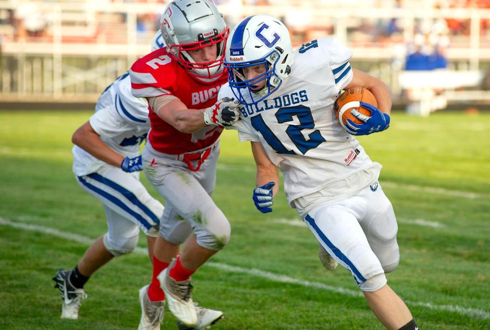 Crestline's Parker Bowman is snagged by Buckeye Central's JR Martin.