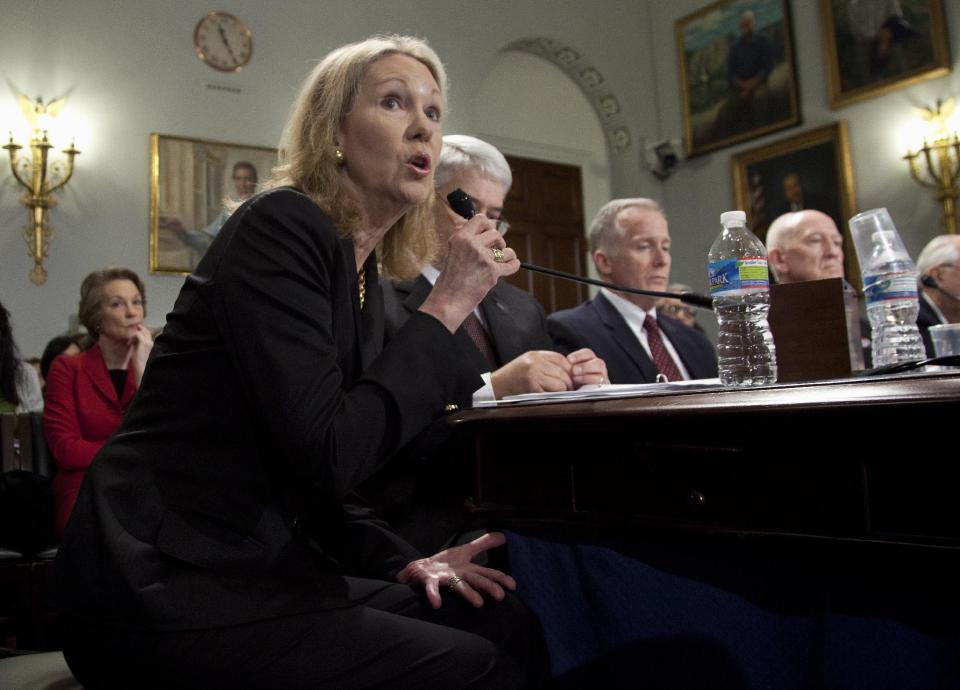 Anne Eisenhower, granddaughter of President Dwight D. Eisenhower testifies on Capitol Hill in Washington, Tuesday, March 20, 2012, before the House National Parks, Forest and Public Lands subcommittee hearing to object to the proposed design of the Dwight D. Eisenhower Memorial on the National Mall. At left in the background is Susan Eisenhower, another Eisenhower granddaughter. At right of Anne is Stephen E. Whitesell of the National Park Service, William J. Guerin, Office of Construction Programs GSA, and Brig. Gen. Carl Reddel, USAF Retired, of the Dwight D. Eisenhower Memorial Commission. (AP Photo/Carolyn Kaster)