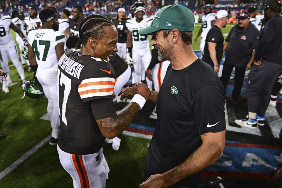 New York Jets quarterback Aaron Rodgers, right, and Cleveland Browns quarterback Dorian Thompson-Robinson (17) laugh following the Hall of Fame NFL football preseason game Thursday, Aug. 3, 2023, in Canton, Ohio. The Browns won 21-16. (AP Photo/David Dermer)