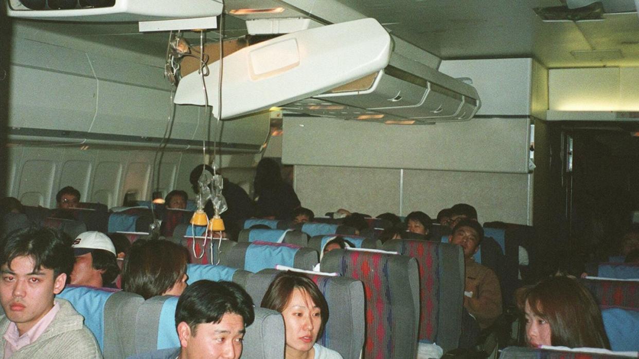 passengers aboard united airlines flight 826 sit u