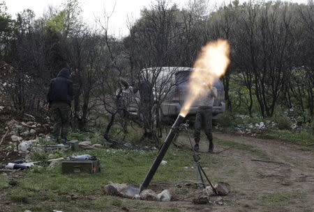 Rebel fighters fire mortar shells at the frontline in the Jabal al-Akrad area in Syria's northwestern Latakia province, April 29, 2015. REUTERS/Khalil Ashawi