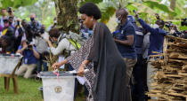 Uganda's leading opposition challenger Bobi Wine's wife, Barbie Kyagulanyi, casts her vote in Kampala, Uganda, Thursday, Jan. 14, 2021. Ugandans are voting in a presidential election tainted by widespread violence that some fear could escalate as security forces try to stop supporters of Wine from monitoring polling stations.(AP Photo/Nicholas Bamulanzeki)