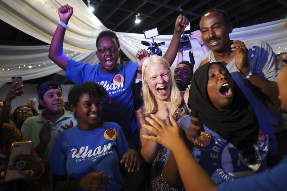 Supporters of Congressional District 5 candidate Ilhan Omar gather at Safari Restaurant in south Minneapolis, Tuesday, Aug. 14, 2018. Somali-American legislator Omar made history Tuesday, Aug. 14, 2018, by winning the Democratic congressional primary in a Minneapolis-area district so reliably liberal that her victory is likely her ticket to Congress. (Mark Vancleave/Star Tribune via AP)