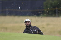 Spain's Jon Rahm plays out of a bunker on the 2nd green during a practice round for the British Open Golf Championships at the Royal Liverpool Golf Club in Hoylake, England, Tuesday, July 18, 2023. The Open starts Thursday, July 20. (AP Photo/Peter Morrison)